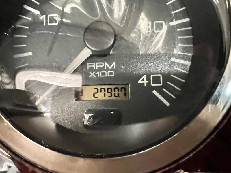 Slide: The Image of Close-up of a 2002 Sea Ray 410 Sundancer RPM gauge displaying 27907. - 15