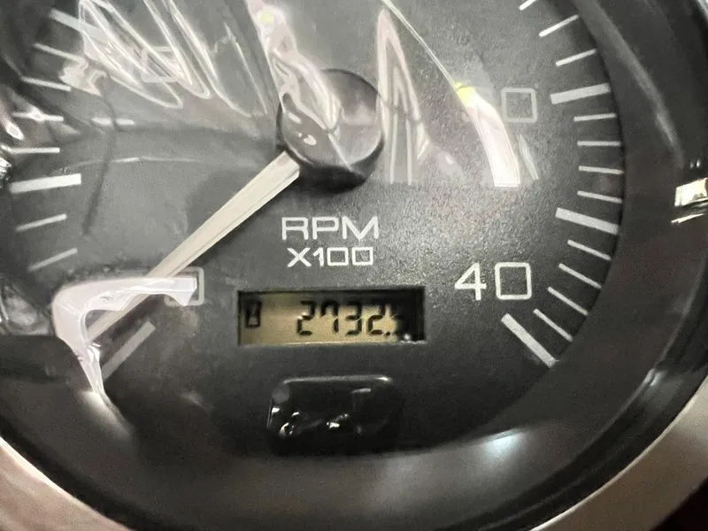 Slide: The Image of Close-up of a 2002 Sea Ray 410 Sundancer tachometer showing 2732.4 RPM. - 17