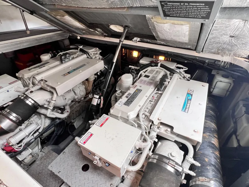 Slide: The Image of Engine room of a 2002 Sea Ray 410 Sundancer with twin marine engines. - 25