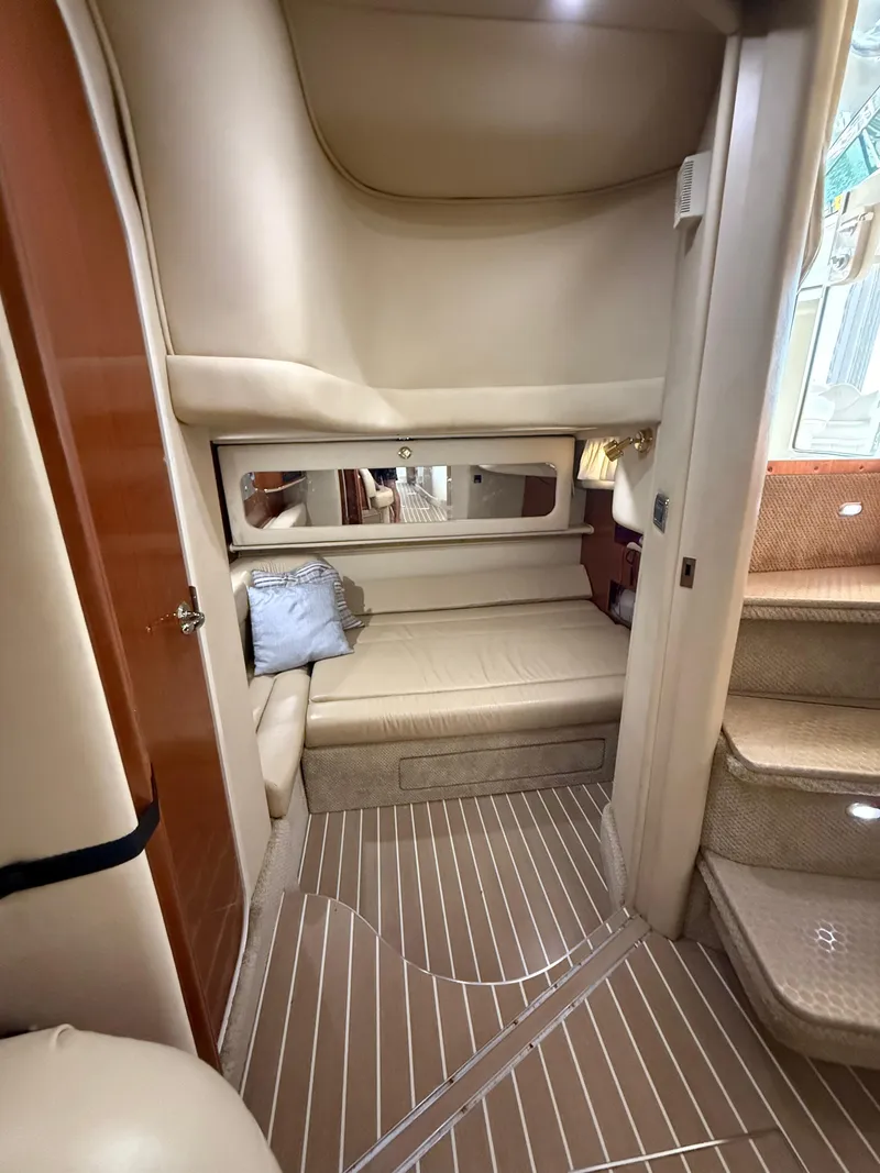 Slide: The Image of Interior of 2002 Sea Ray 410 Sundancer yacht, featuring cozy seating and elegant design. - 7