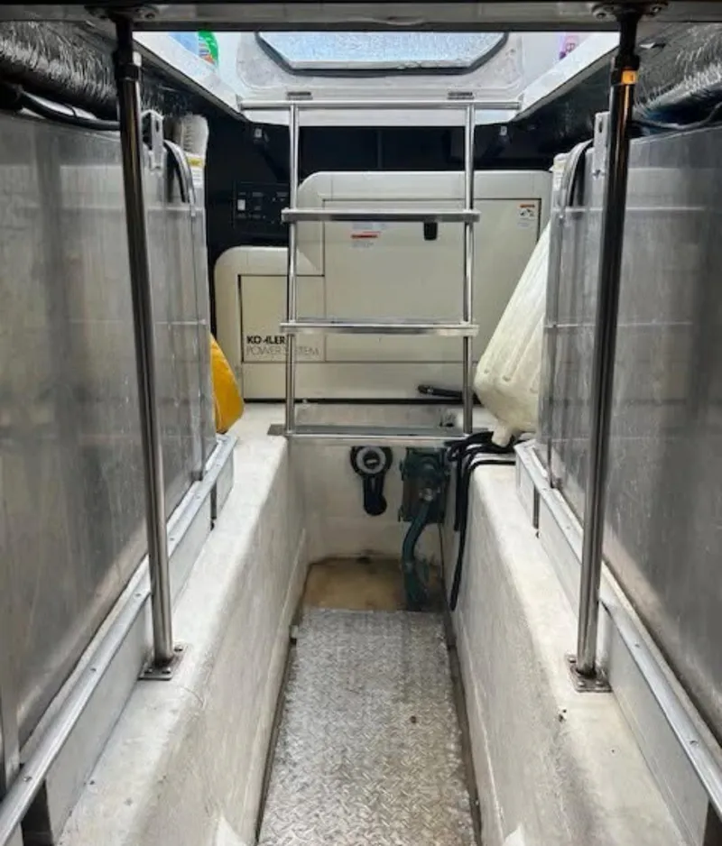 Slide: The Image of 2000 Carver 450 Voyager Pilothouse interior with ladder and equipment. - 10