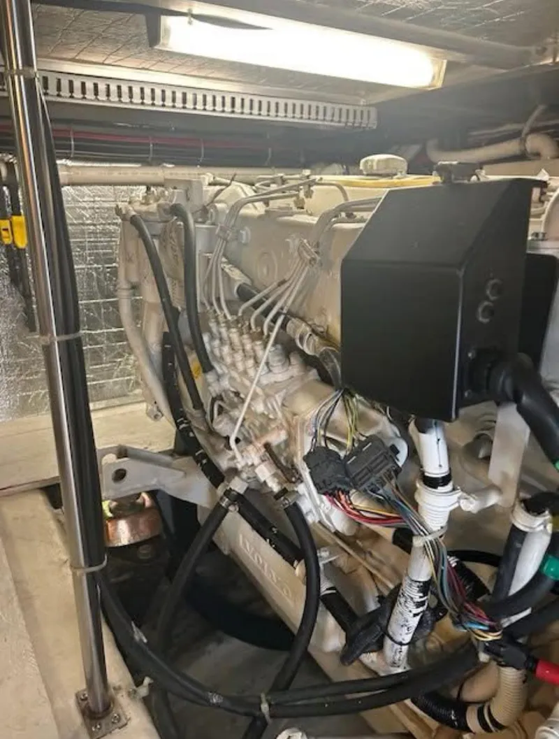 Slide: The Image of Engine room of 2000 Carver 450 Voyager Pilothouse with visible wiring and components. - 11