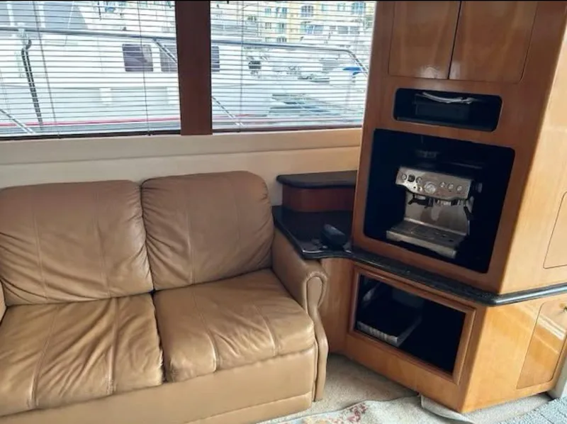 Slide: The Image of Interior of 2000 Carver 450 Voyager Pilothouse with leather sofa and built-in coffee machine. - 6