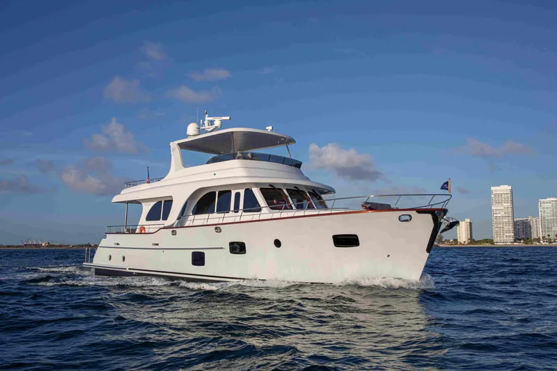 The Image of 2020 Vicem 67 Cruiser yacht sailing on open water under a clear blue sky. - 0