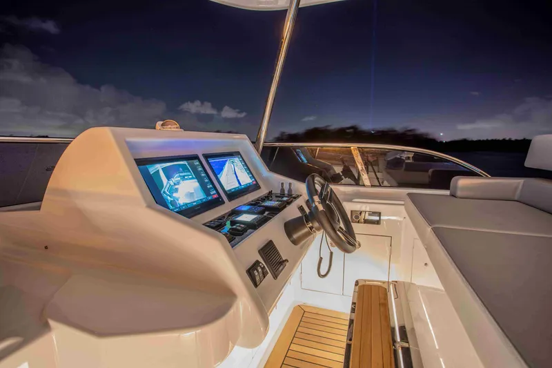 Slide: The Image of Cockpit of 2020 Vicem 67 Cruiser yacht with illuminated navigation screens at night. - 11