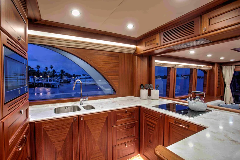 Slide: The Image of Luxurious kitchen interior of 2020 Vicem 67 Cruiser yacht with elegant wood cabinetry and modern appliances. - 19