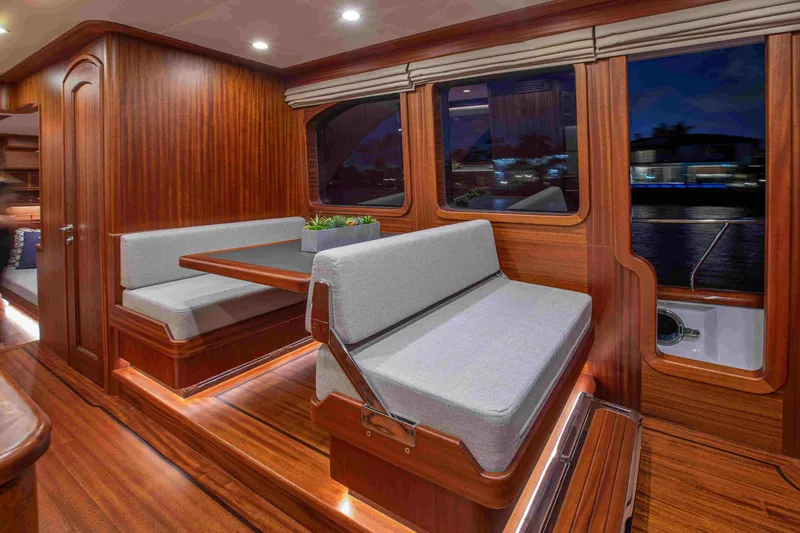 Slide: The Image of Luxurious interior of 2020 Vicem 67 Cruiser with elegant wood finish and plush seating. - 21