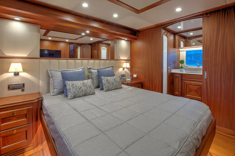 Slide: The Image of Luxurious bedroom interior of 2020 Vicem 67 Cruiser yacht with elegant wood finishes. - 22