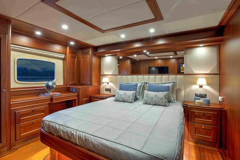 Slide: The Image of Luxurious cabin interior of 2020 Vicem 67 Cruiser with elegant wood finish and cozy bedding. - 23
