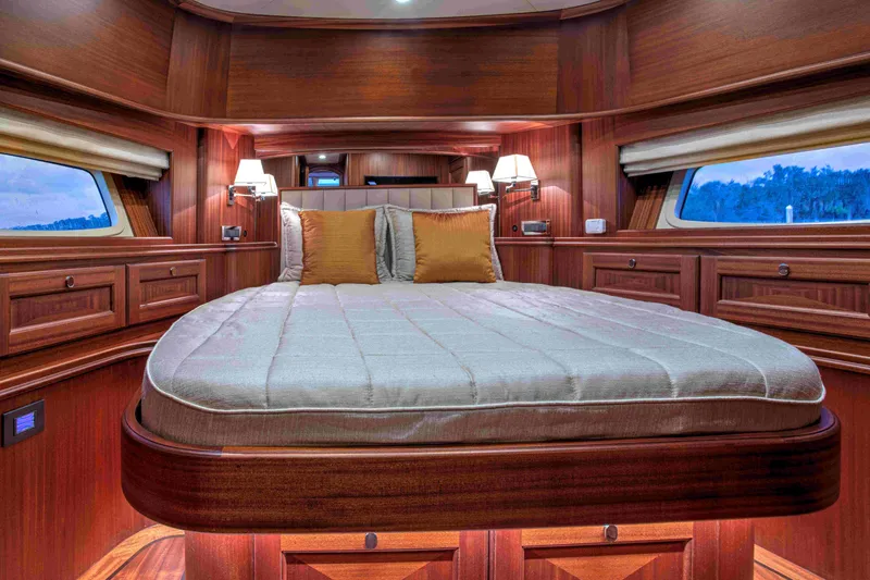 Slide: The Image of Luxurious cabin interior of 2020 Vicem 67 Cruiser with elegant wood finish and cozy bedding. - 24