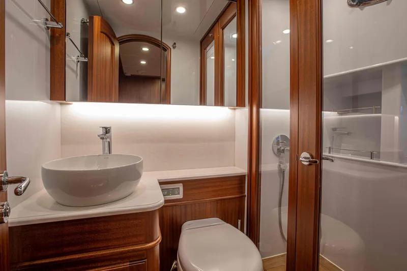 Slide: The Image of Luxurious bathroom interior of 2020 Vicem 67 Cruiser yacht with modern fixtures and wooden accents. - 28