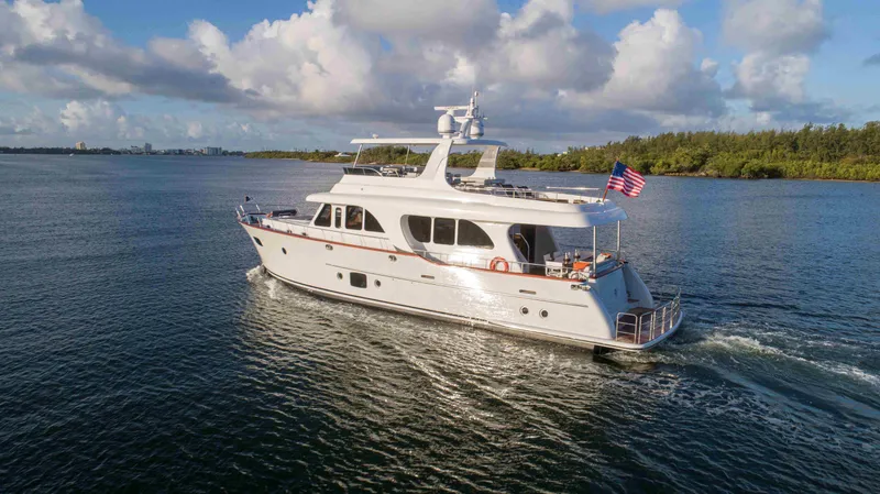 Slide: The Image of 2020 Vicem 67 Cruiser yacht sailing on a sunny day with an American flag. - 3