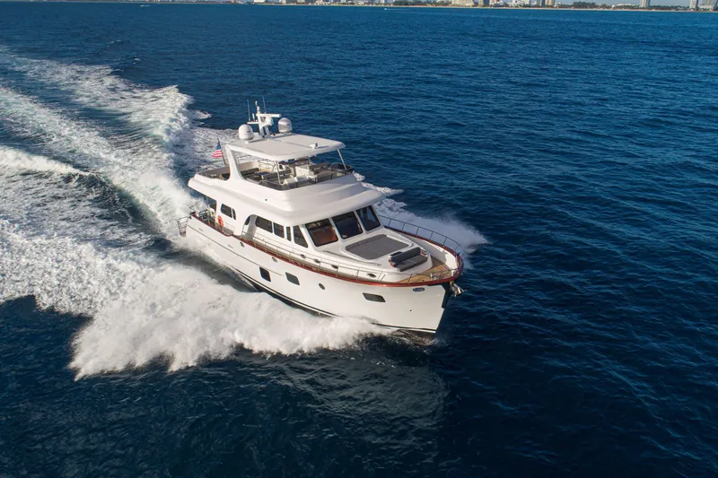 Slide: The Image of 2020 Vicem 67 Cruiser yacht navigating through open blue waters. - 4