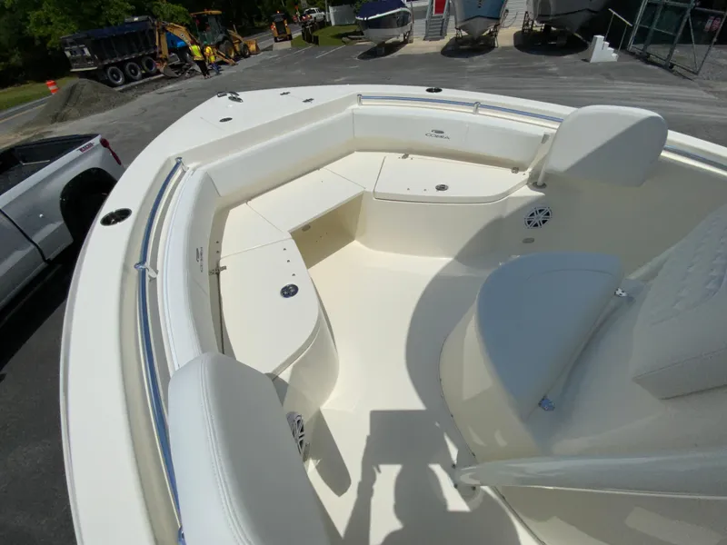 Slide: The Image of 2025 Cobia 220 Center Console boat interior with seating and storage compartments. - 17