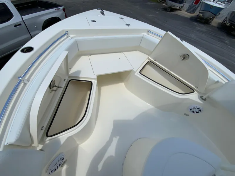 Slide: The Image of 2025 Cobia 220 Center Console boat interior with open storage compartments. - 18