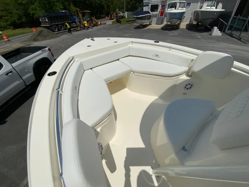 Slide: The Image of 2025 Cobia 220 Center Console boat with spacious seating and modern design. - 19