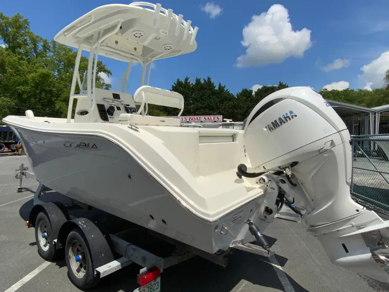 Slide: The Image of 2025 Cobia 220 Center Console boat on trailer with Yamaha outboard motor. - 7