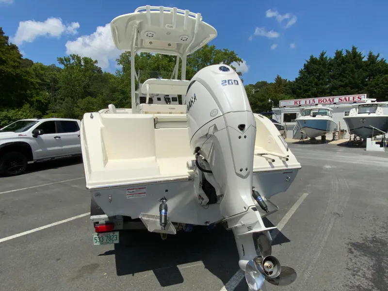 Slide: The Image of 2025 Cobia 220 Center Console boat with Yamaha 250 engine at dealership. - 8