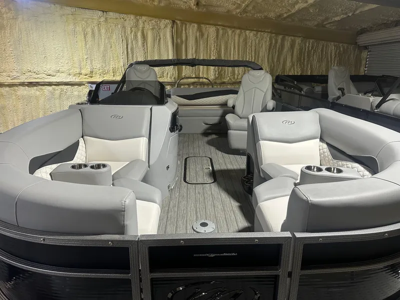 Slide: The Image of 2022 Manitou 23 Encore SL pontoon boat with luxurious seating and modern design. - 7