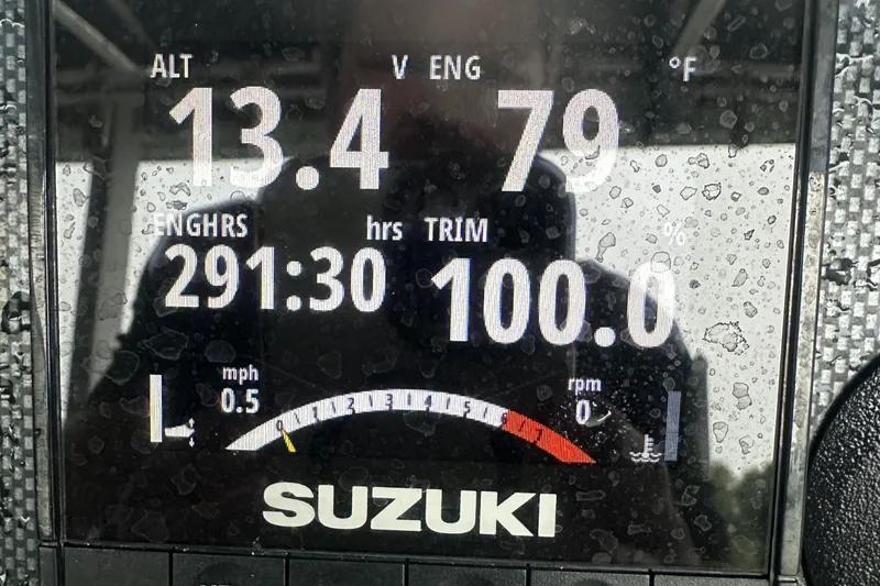 Slide: The Image of Display screen of a Suzuki engine showing various metrics, including engine hours and trim. - 13