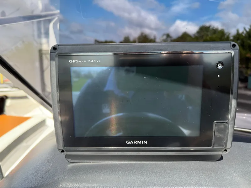 Slide: The Image of Garmin GPSMAP 741xs on 2016 Yamaha AR240 boat dashboard, under a clear blue sky. - 23