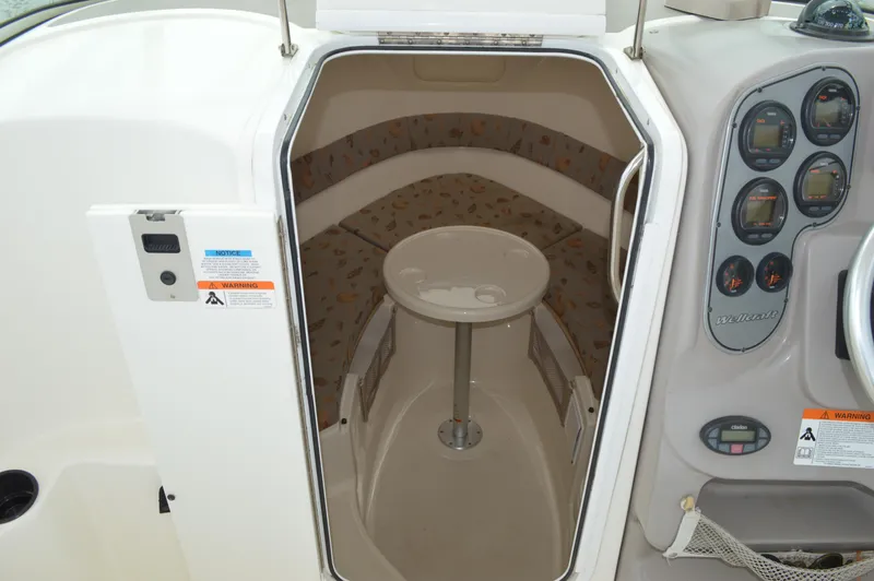 Slide: The Image of 2005 Wellcraft 252 Coastal cabin interior with seating and table. - 38