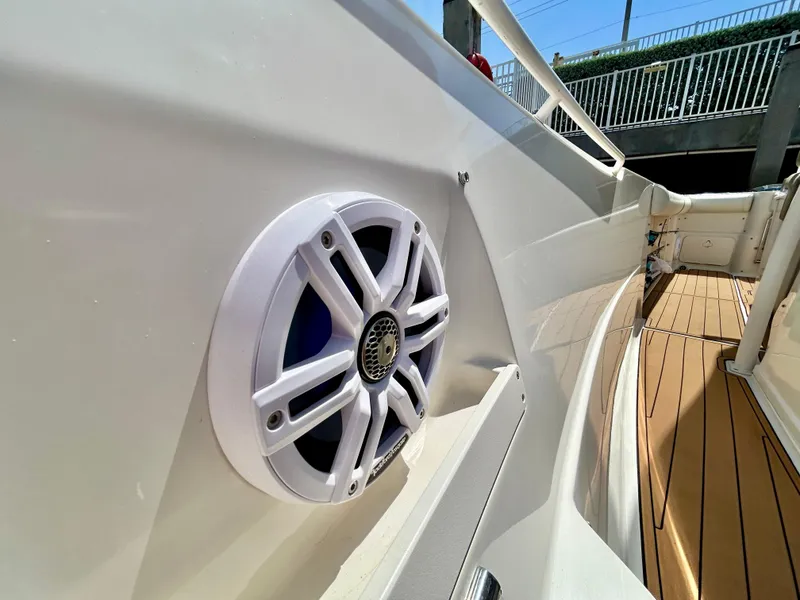 Slide: The Image of Close-up of a 2013 Sailfish 270 CC boat speaker and deck. - 16