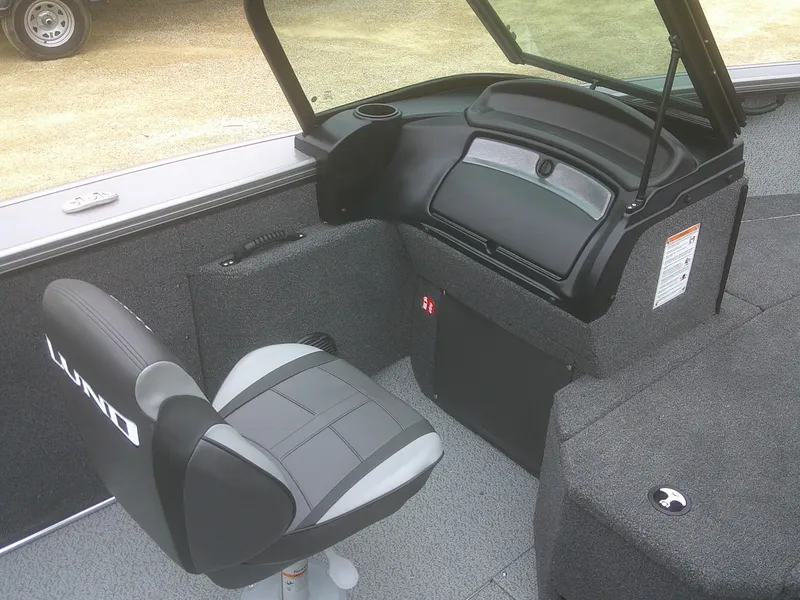 Slide: The Image of 2025 Lund 2075 Fisherman boat interior with seating and dashboard. - 11