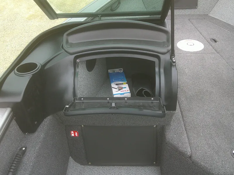 Slide: The Image of 2025 Lund 2075 Fisherman boat interior storage compartment with open hatch. - 12