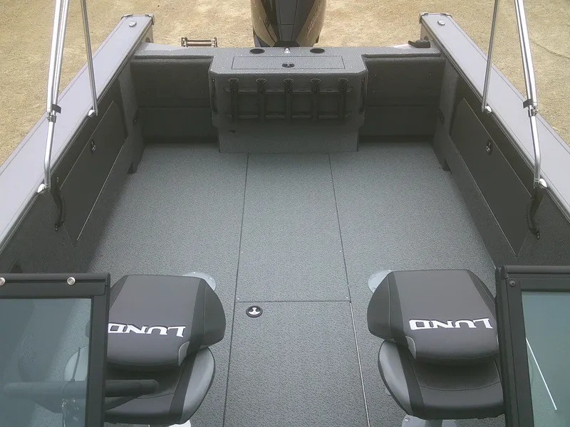 Slide: The Image of 2025 Lund 2075 Fisherman boat interior with seating and storage compartments. - 15