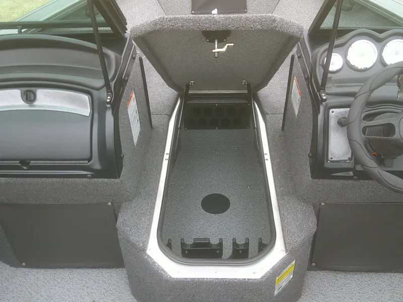 Slide: The Image of 2025 Lund 2075 Fisherman boat interior with open storage compartment and dashboard view. - 7