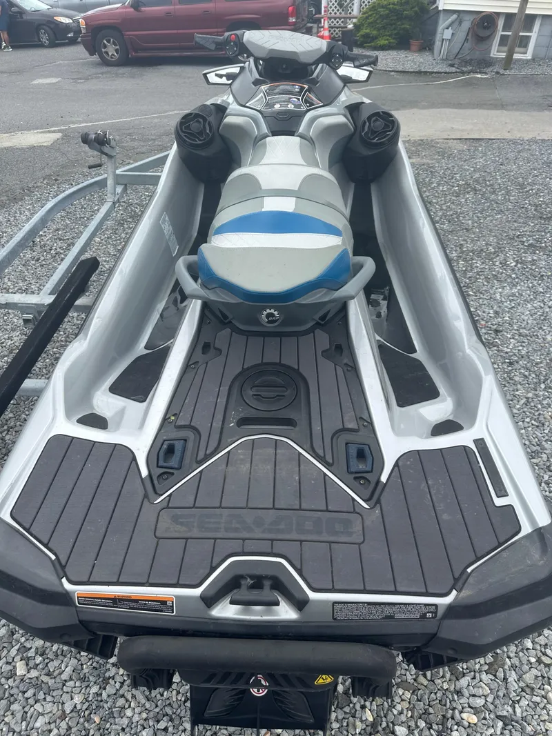 Slide: The Image of 2020 Sea-Doo GTX Limited 300 jet ski on gravel, rear view. - 10