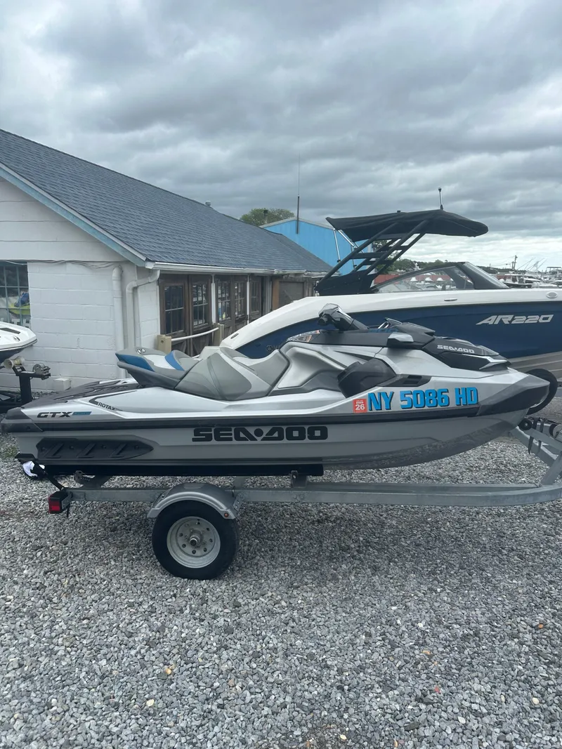 Slide: The Image of 2020 Sea-Doo GTX Limited 300 on trailer, parked outdoors on gravel. - 4