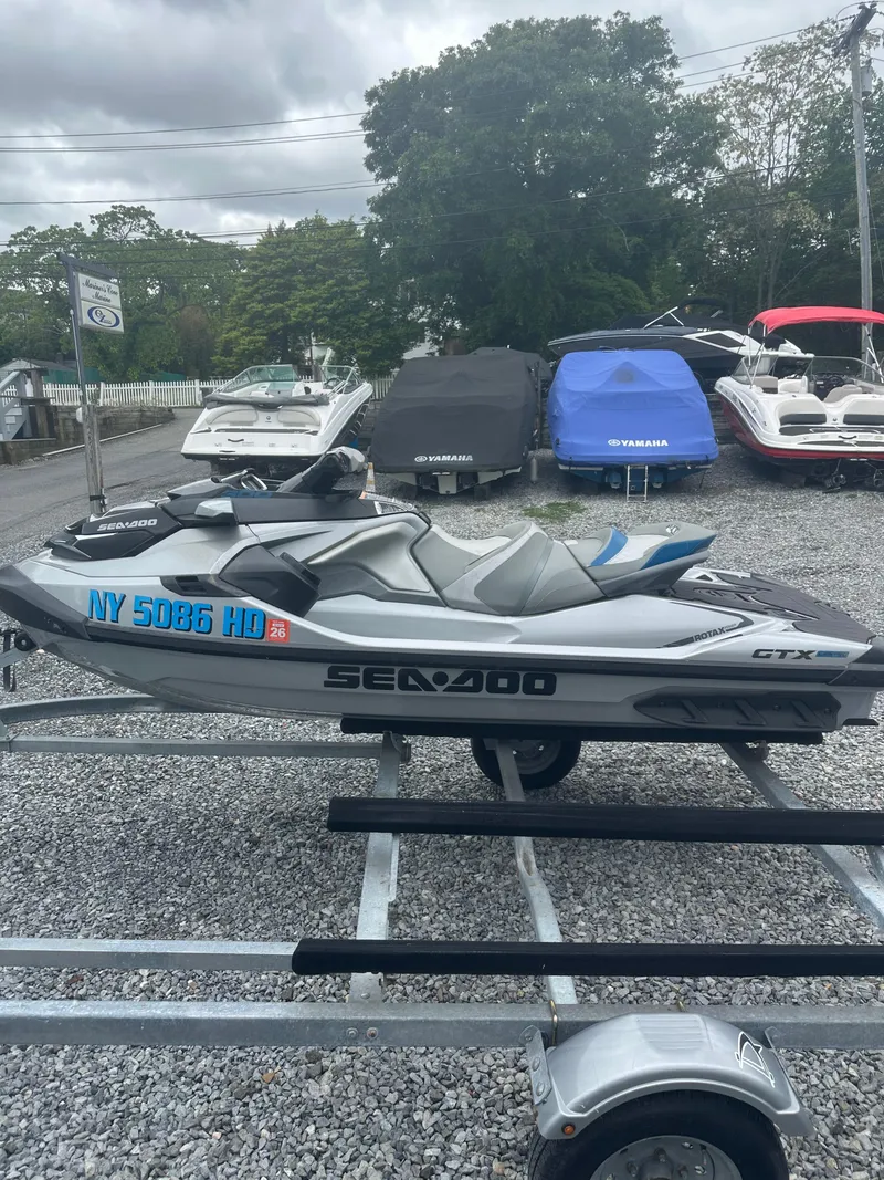Slide: The Image of 2020 Sea-Doo GTX Limited 300 jet ski on trailer, parked outdoors. - 6