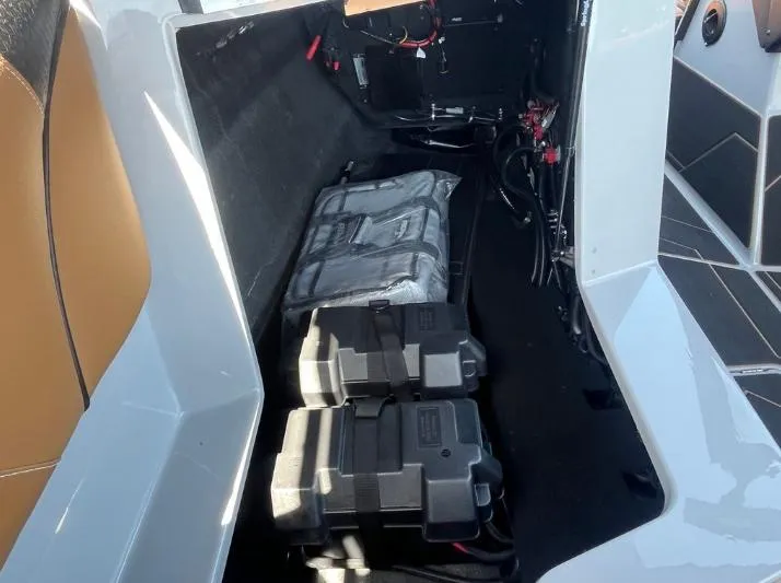 Slide: The Image of 2025 Supreme S240 boat interior showing battery compartment and wiring. - 25