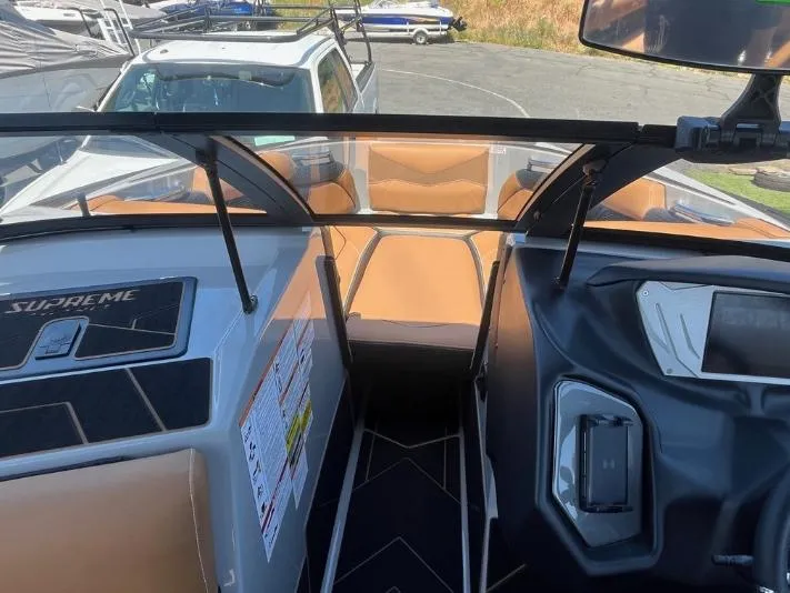Slide: The Image of 2025 Supreme S240 boat interior with modern dashboard and seating. - 30