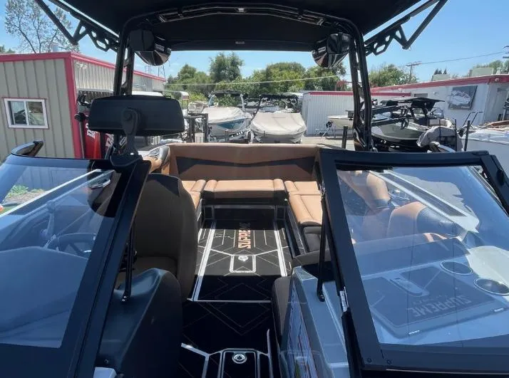 Slide: The Image of Interior view of 2025 Supreme S240 boat, featuring sleek design and comfortable seating. - 36