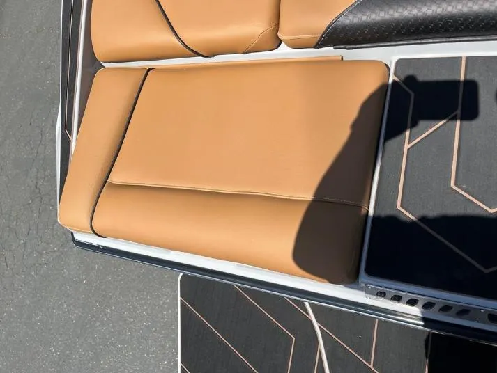 Slide: The Image of Tan leather seating on a 2025 Supreme S240 boat, featuring modern design and comfort. - 4