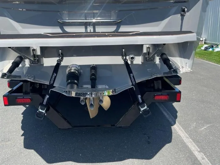Slide: The Image of Rear view of 2025 Supreme S240 boat with propeller and trim tabs. - 6