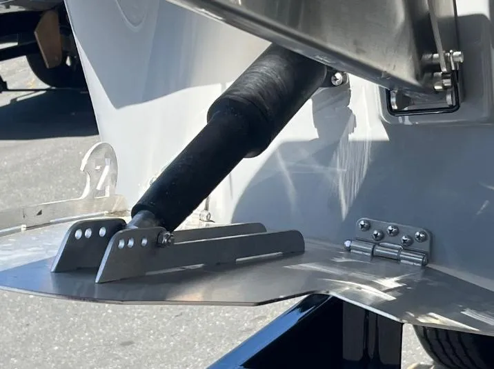Slide: The Image of Close-up of 2025 Supreme S240 boat's trim tab and hydraulic system. - 7