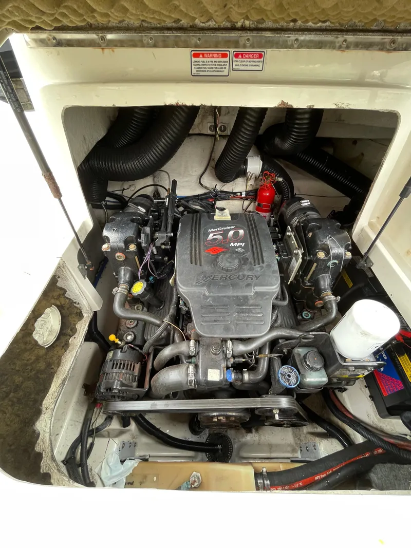 Slide: The Image of Engine compartment of a 2004 Sea Ray 220 Sundeck boat. - 2