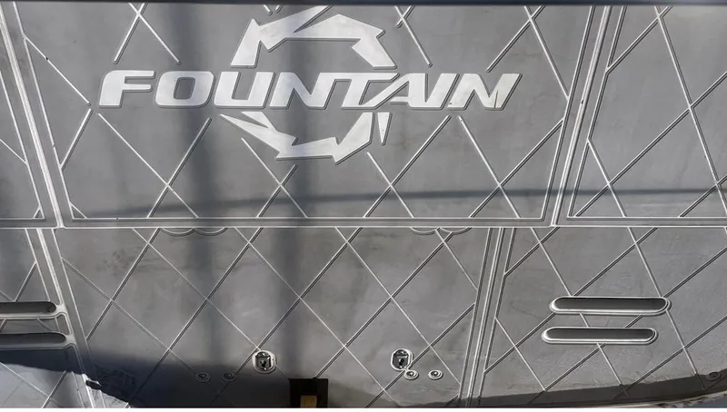 Slide: The Image of 2002 Fountain 38 Express Cruiser boat deck with logo and geometric pattern. - 10