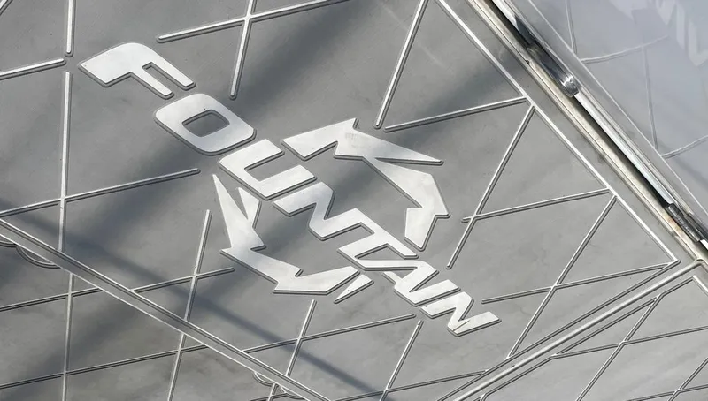 Slide: The Image of Fountain 38 Express Cruiser 2002 logo on a textured surface. - 11