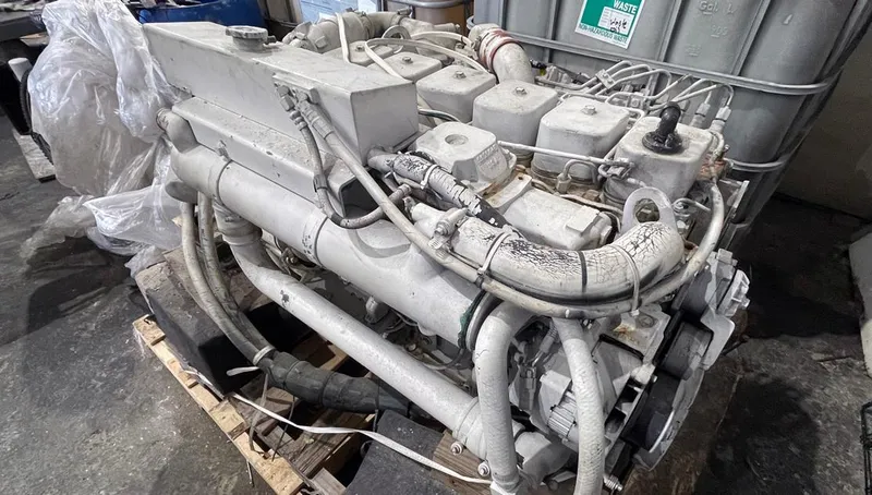 Slide: The Image of 2002 Fountain 38 Express Cruiser engine on a wooden pallet in a workshop. - 17