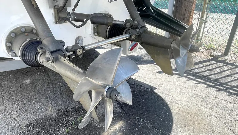 Slide: The Image of Propellers of a 2002 Fountain 38 Express Cruiser boat on dry land. - 4