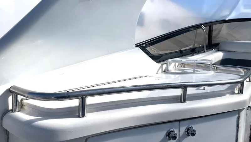 Slide: The Image of 2002 Fountain 38 Express Cruiser, sleek white deck with stainless steel railings. - 8