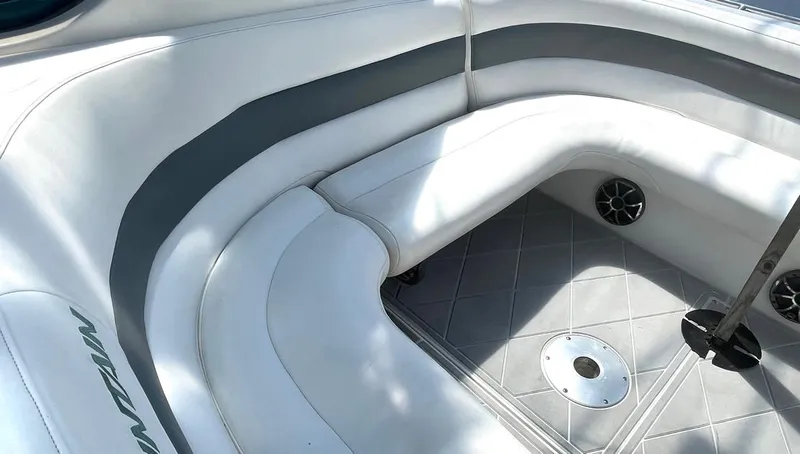 Slide: The Image of 2002 Fountain 38 Express Cruiser interior with white seating and gray accents. - 9
