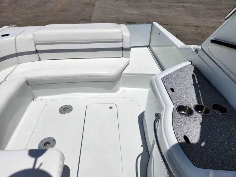 Slide: The Image of 2007 Formula 330 Sun Sport boat interior with white seating and cup holders. - 15