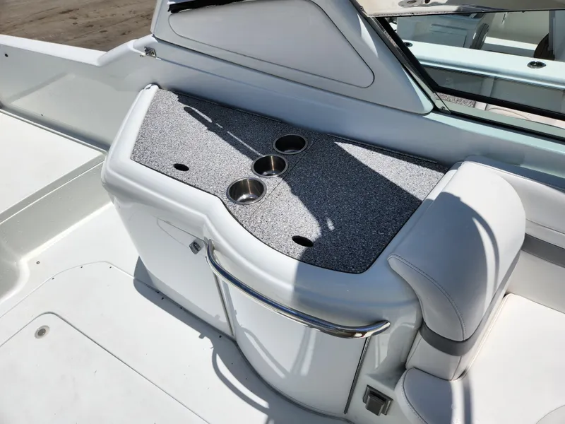 Slide: The Image of 2007 Formula 330 Sun Sport boat interior with cup holders and seating. - 16