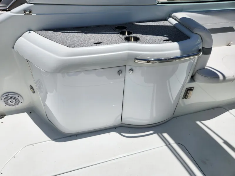 Slide: The Image of 2007 Formula 330 Sun Sport boat interior with sleek white cabinetry and cup holders. - 18